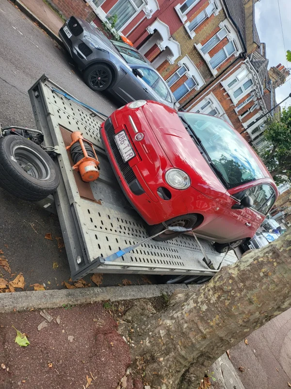 red-classic-car-towing